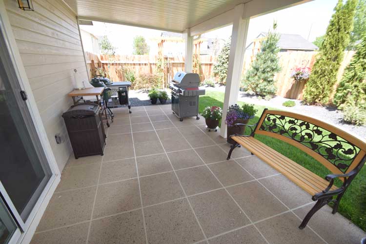 Patio concrete overlay resurface with custom design and color and patio cover