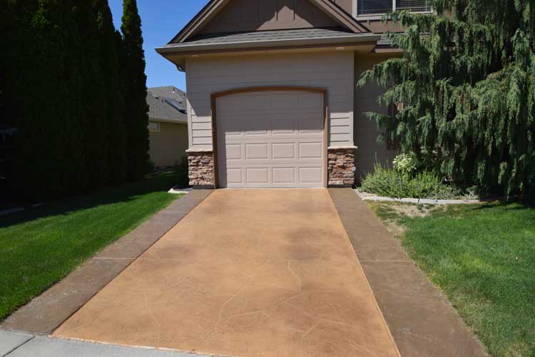 Driveway concrete overlay resurface with custom design and color and patio cover