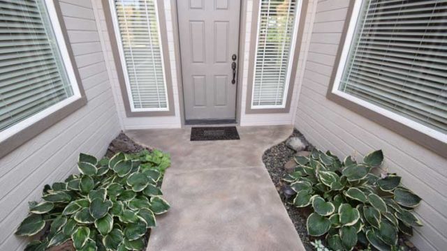 Patio concrete entry resurface with custom design and color and patio cover