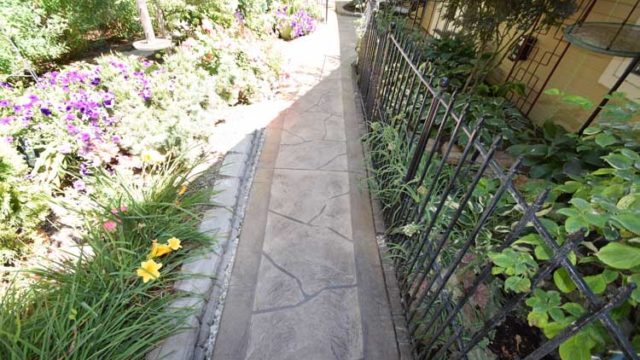 Patio concrete walkway resurface with custom design and color and patio cover
