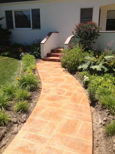 Patio concrete entry resurface with custom design and color and patio cover